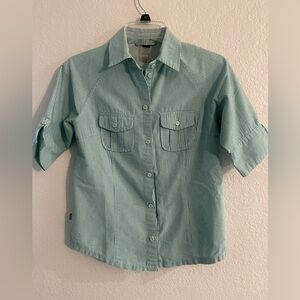 REI woman’s performance top with front pocket and mesh lining in back size XS